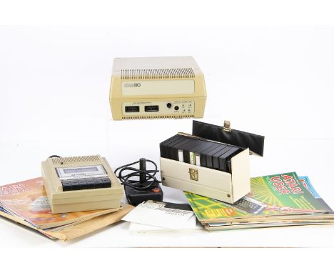 Atari Computing Equipment, including Atari 810 Disk Drive with manual, Atari 410 Program Recorder, a quantity of cassettes an