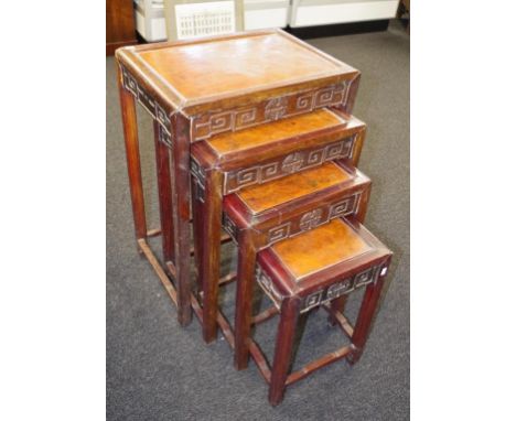 Vintage Chinese nest of four carved tables each with carved wood aprons, (requires restoration), (height 71cm, width 47cm app