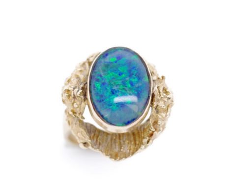 Opal triplet and 9ct yellow gold Modernist ring marked 9ct. Approx weight 7 grams, ring size N. Shwing some loss to triplet