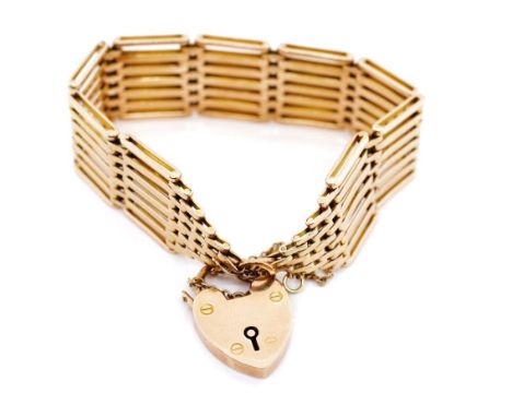 Edwardian 9ct rose gold bracelet with 7 bar gate links and heart padlock. Marked 9ct and J.G. 9ct to clasp. Approx weight 30.