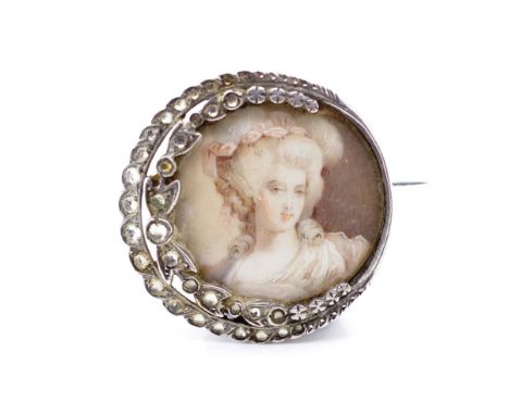 Antique portrait miniature and silver brooch with well painted picture of a lady. The brooch is set with paste Approx width 2