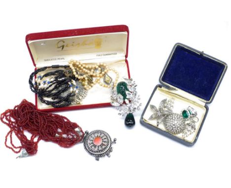 Group of vintage jewellery includes a good brooch, earrings, a beaded necklace, and a mid century gold filled pendant