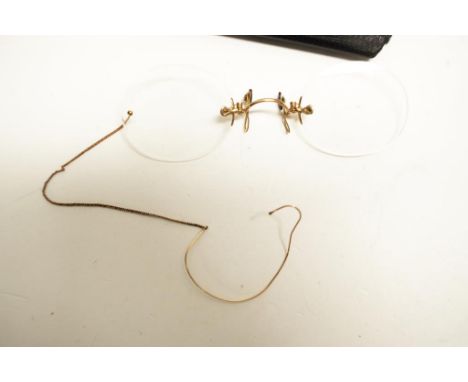 Vintage set yellow gold pince-nez spectacles gold nose piece and suspending chain. With original fitted carry case,. Test 9ct