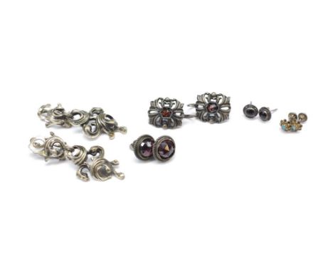 Five antique and vintage earrings includes a continental silver and garnet example, cast metal ear clips and other studs
