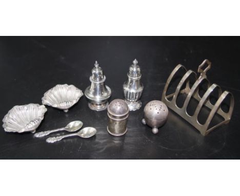 Seven vintage sterling silver condiment pieces including pair Edwardian shell form open salts, Chester 1905, (plus 2 condimen