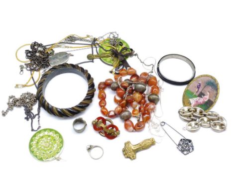 A group of silver and costume jewellery includes antique and vintage pieces, silver anchor link bracelets, silver chains and 