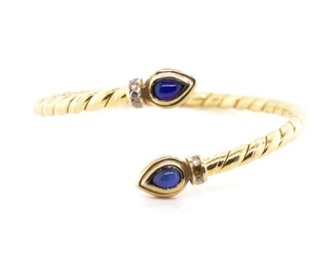 18ct yellow gold rope twist bangle set with sapphire drop cabochons and 9x round brilliant cut diamonds (one missing from set