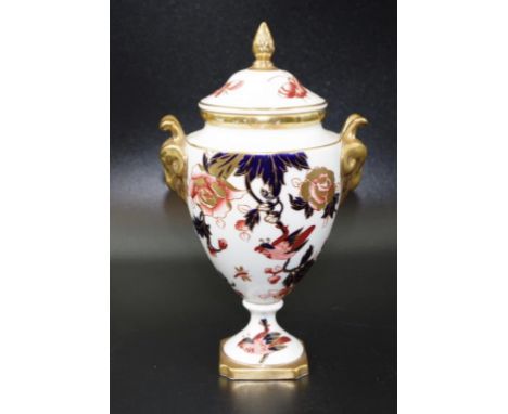 Coalport Imari pattern lidded urn with rams head handles and acorn finial, height 18cm approx