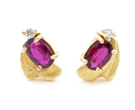 Ruby and diamond set 18ct yellow gold earrings marked 750. Approx weight 2.7 grams