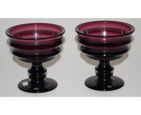 Two Kosta Boda amethyst art glass footed bowls height 13cm approx