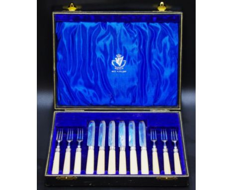 Cased  vintage twelve piece fruit cutlery set including 6 each fruit knives and forks, 'bone' handles, silver plate blades an