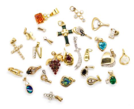 A group of gemstone set gold pendants in marked 18ct, 14ct and 9ct gold. Set with diamonds, rubies, sapphires, cubic zirconia