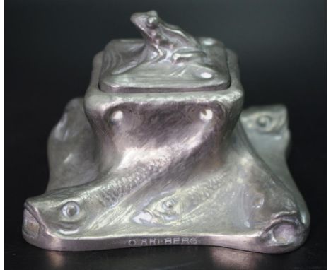 Swedish art nouveau pewter ink well circa1890, with in relief fish decorated base and frog finial and fitted glass insert, wi
