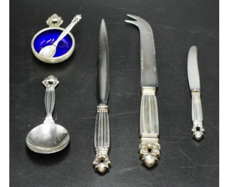 Four Georg Jensen 'Acorn' sterling pieces including letter opener; cheese knife; caddy spoon; and butter knife; together with