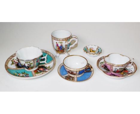 Collection of Dresden hand painted ceramics including 3 various coffee cups and saucers, a tri-footed vase, and a miniature b