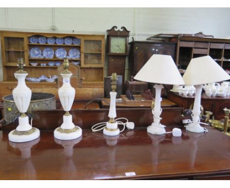 A pair of alabaster table lamps, another pair of giltmetal mounts and another table lamp (5)