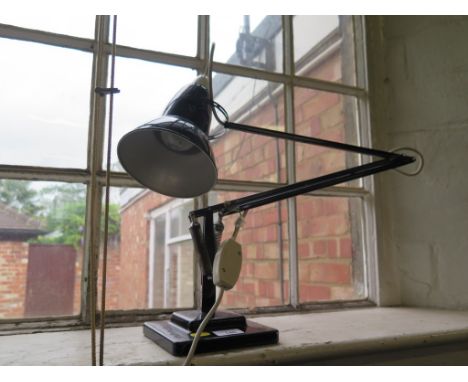 A black metal 'Anglepoise' lamp by Herbert Terry &amp; Sons