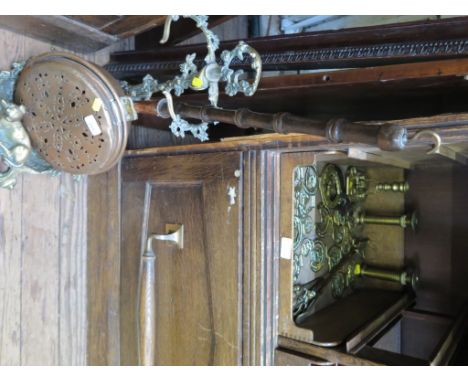 A cast brass umbrella stand, depicting a hunting scene, a copper warming pan and various horse brasses and brassware