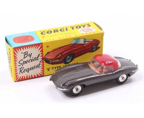 Corgi Toys No. 307 E-type Jaguar E Type with detachable hard top comprising of metallic dark grey body with brown interior an