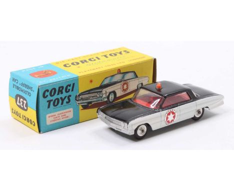 Corgi Toys No. 237 Oldsmobile Sheriff car, comprising of black &amp; white body with red interior with County Sheriff sticker