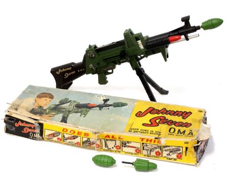 A Deluxe Topper Toys Ltd No. 6025 Johnny Seven OMA One Man Army gun, comprising of green and black body with various missiles