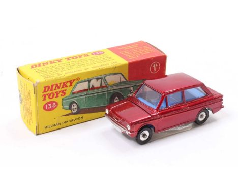 Dinky Toys No. 138 Hillman Imp saloon comprising metallic maroon body with blue interior and spun hubs in the original all-ca