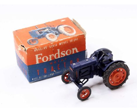 A Chad Valley large scale Fordson diecast tractor, comprising of dark blue body with orange hubs, housed in the original card