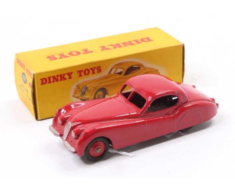 Dinky Toys No. 157 Jaguar XK 120 coupe comprising red body with red hubs, in the original correct colour spot all-card box (V