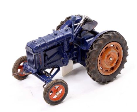 A Chad Valley large scale Fordson diecast large scale tractor, comprising of dark blue body with orange hubs, missing exhaust