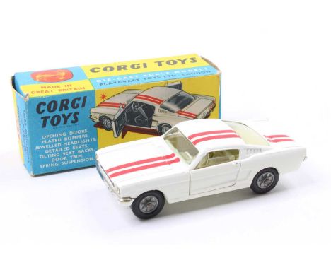 Corgi Toys No. 325 Ford Mustang Fastback 2+2 competition model, comprising of a white body with red twin racing stripe, light