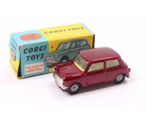 Corgi Toys No. 226 Morris Mini Minor comprising of metallic maroon body with lemon interior, and cast hubs, housed in the ori