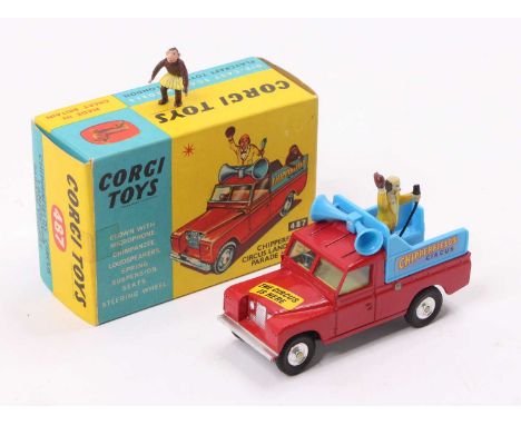 Corgi Toys No. 487 Chipperfield Circus Land Rover Parade vehicle, red body with blue back, standing figure, and monkey figure