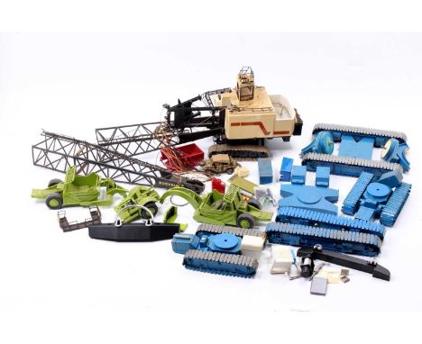 A collection of various resin and white metal part complete, and incomplete construction and earth moving kits to include a p
