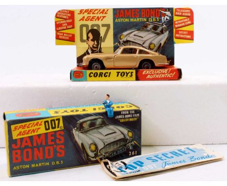 A Corgi Toys No. 261 James Bond's Aston Martin DB5 comprising of gold body with red interior, housed in the original sliding 