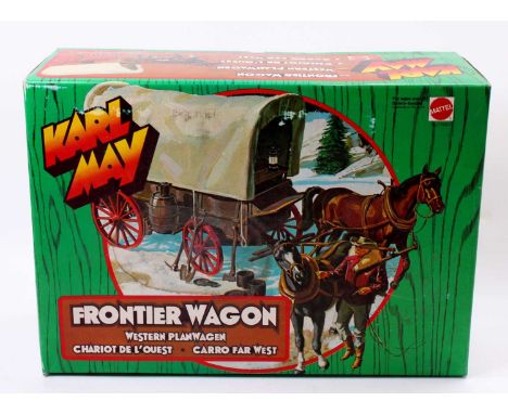 A Mattel 943 Karl May Western Frontier wagon, housed in the original box with packing piece, appears complete with two horses