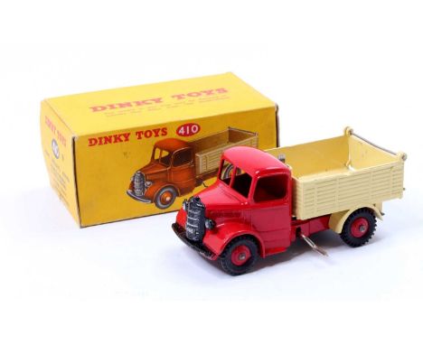 Dinky Toys No. 410 Bedford End Tipper, comprising of a red cab and chassis with cream back and red hubs, housed in the origin