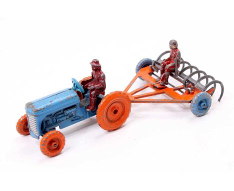 A MOKO early Tractor and Rake, tractor finished in light blue with orange wheels, rake finished in orange with blue wheels an