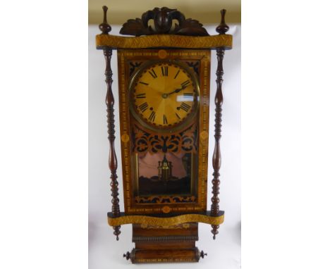 An Edwardian Oak Cased Mantel Clock, the clock having carved finial's to top in the form of urns, reeded columns to side, on 