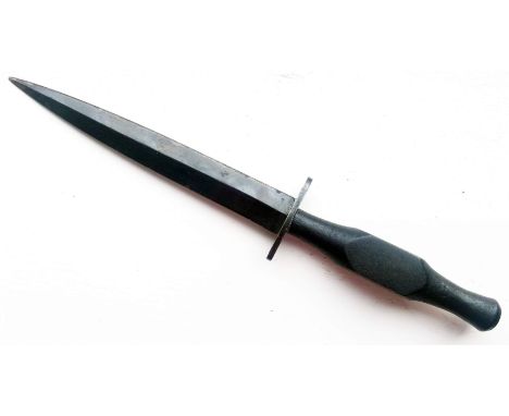 A Rare WWII Wooden Handled Fairbairn Sykes Fighting Knife, the guard stamped with military 'broad arrow' and dated 1942. Leng