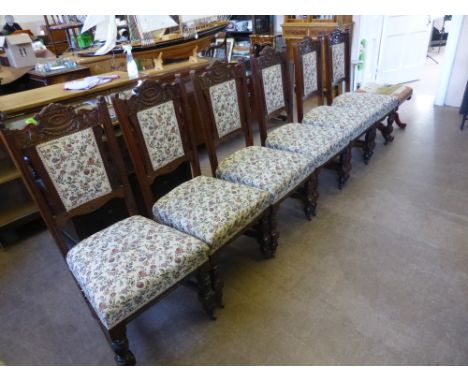 A Set of Six Mahogany Edwardian Dining Chairs, upholstered in tapestry.