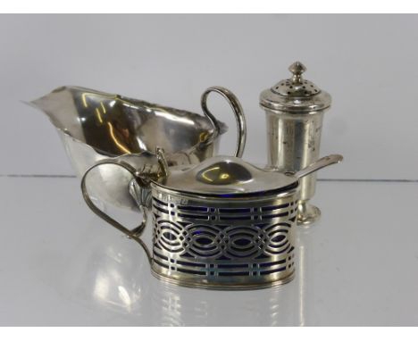 A Silver Mustard Pot, Chester hallmark dd 1912, the mustard with domed hinged lid with thumb piece, the pot of pierced design