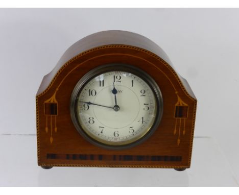 A French Oak and Rosewood Art Deco Mantel Clock, movement stamped S.F.R.A., the clock with decorative inlay, eight day moveme