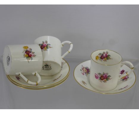 Royal Worcester Bone China Coffee Cans and Saucers, decorated with floral spray.