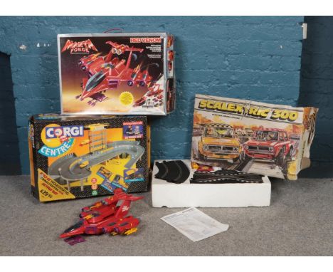 Three boxed toys. To include a Scalextric 200 complete with cars, a Manta Force 'Red Venom' spaceship and a Corgi AA service 