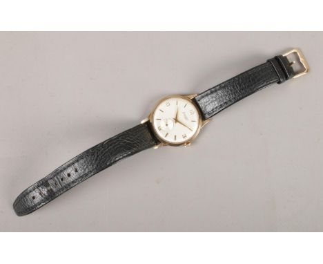 A vintage Gents Accurist mechanical wristwatch, with 9ct gold front and back and 21 jewel Swiss movement. On black leather st