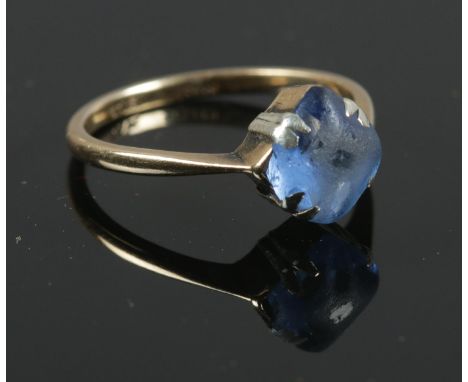 A 9ct gold ring with central blue stone. Size L. Total weight 1.78g.  