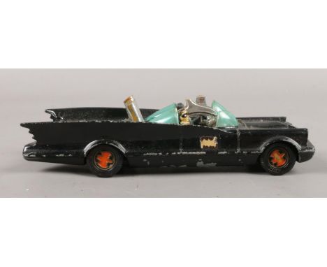 A vintage Corgi toys Batman Batmobile. No.267, with red bat hubs, Batman and Robin.  