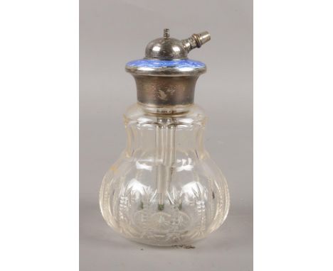 A glass atomiser perfume bottle with silver &amp; enamel top. 12cm height.  