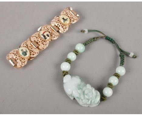 A carved jade bracelet formed as a dog of foe along with a yellow metal Guinness bracelet.  