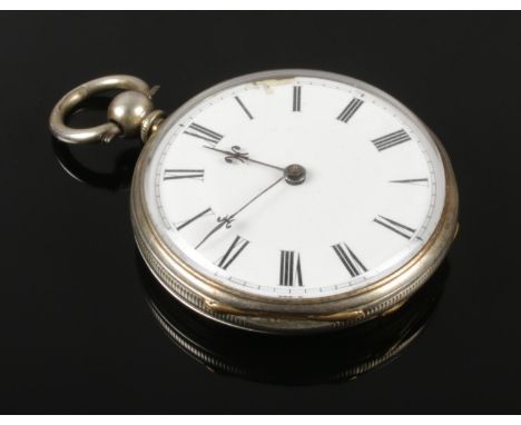 A silver fob watch. With enamel dial and Roman numeral markers.  